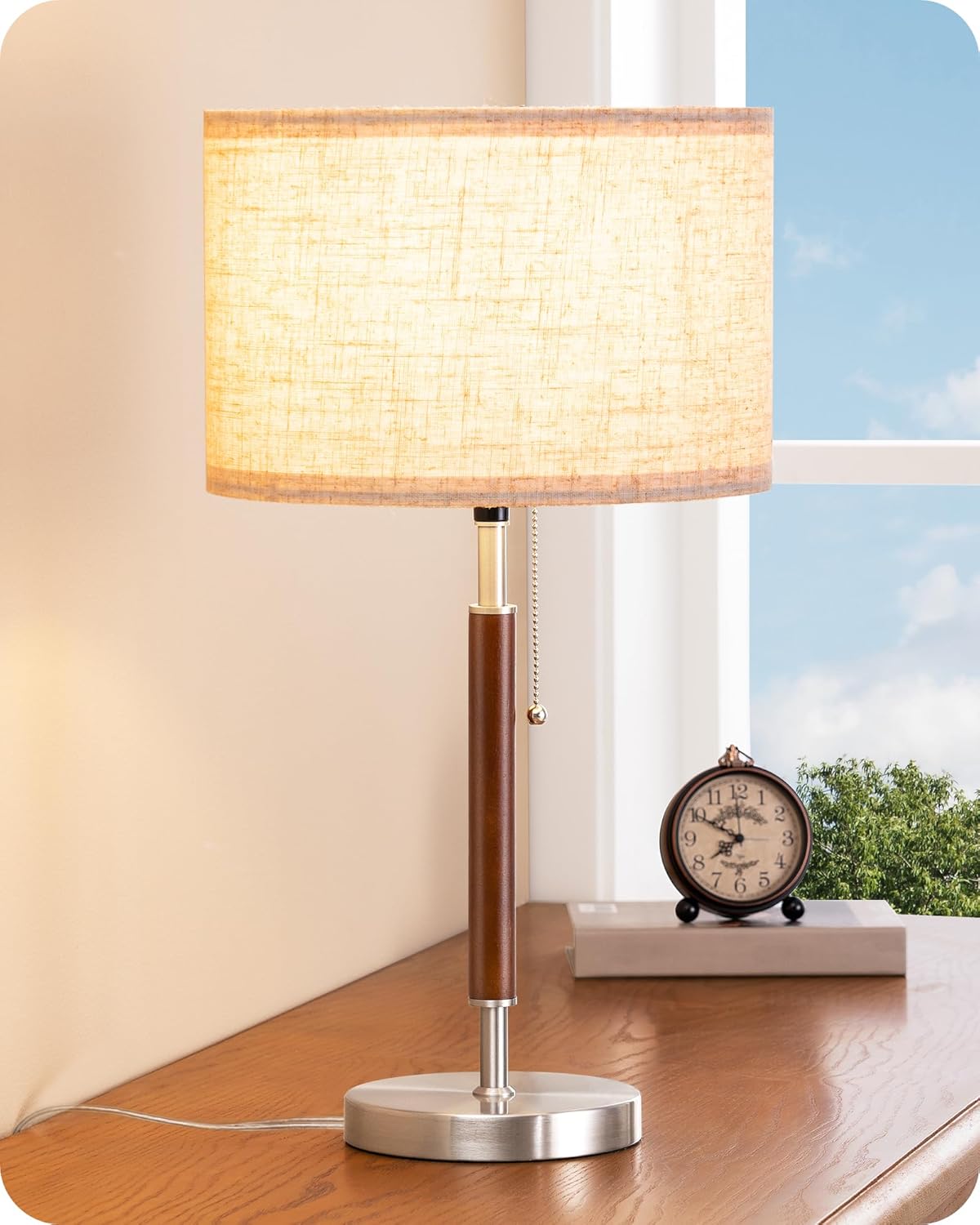 Mid-century style table lamp—a bedside lamp featuring a pull-chain switch and a design combining solid wood with a metal stem.
