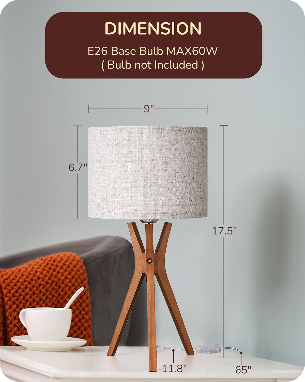 Mid-century style table lamp — featuring a dark wood base and a beige linen shade.